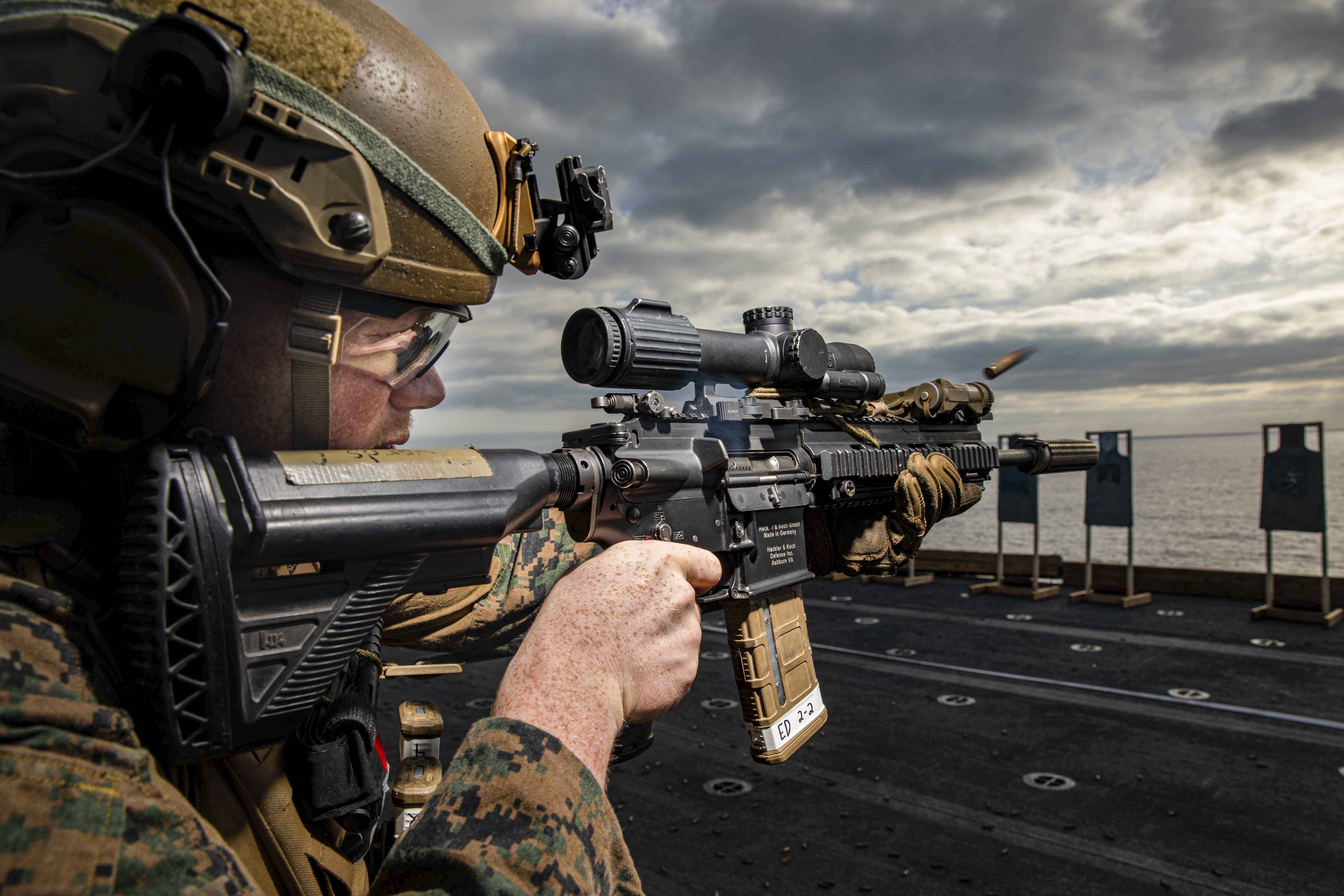 Marine Corps Lance Cpl. Camron Edwards participates in a live-fire range aboard the USS Kearsarge in the Atlantic Ocean, July 15, 2022.