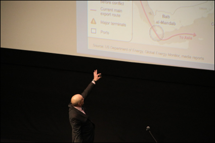 Dr. Amin Tarzi pointing at large screen while lecturing. Dr. Amin Tarzi pointing at large screen while lecturing.